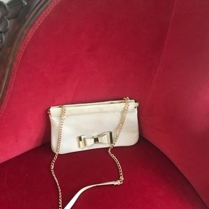 Cream clutch with gold accents